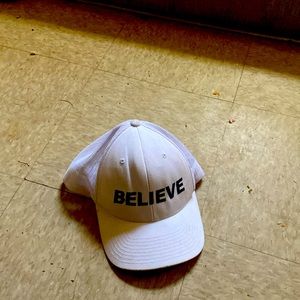 A hat it’s says believe and it’s white